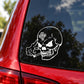 White skull vinyl car decal sticker on dark car window