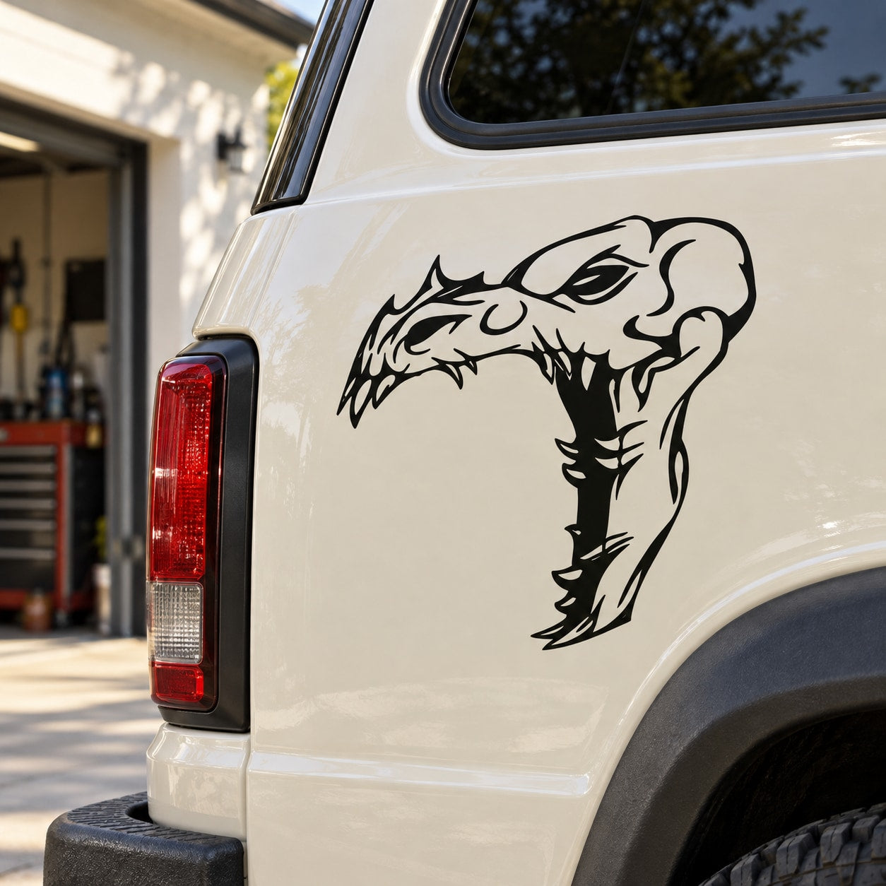 Skull vinyl decal with bold black skull face and flame-like detailing