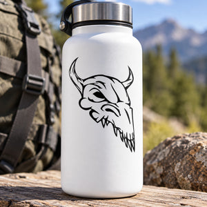 Skull vinyl decal with black skull face graphic on white surface