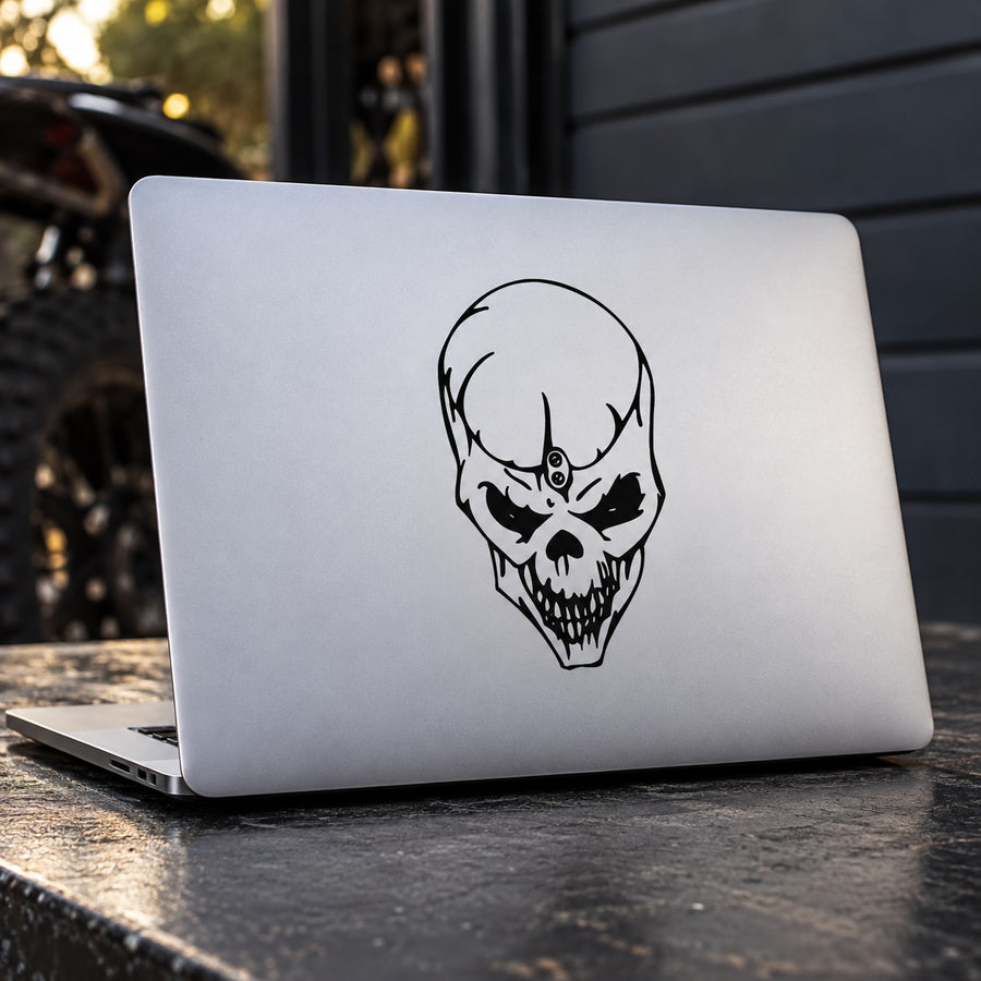 Skull vinyl decal with black outline and small center eye symbol