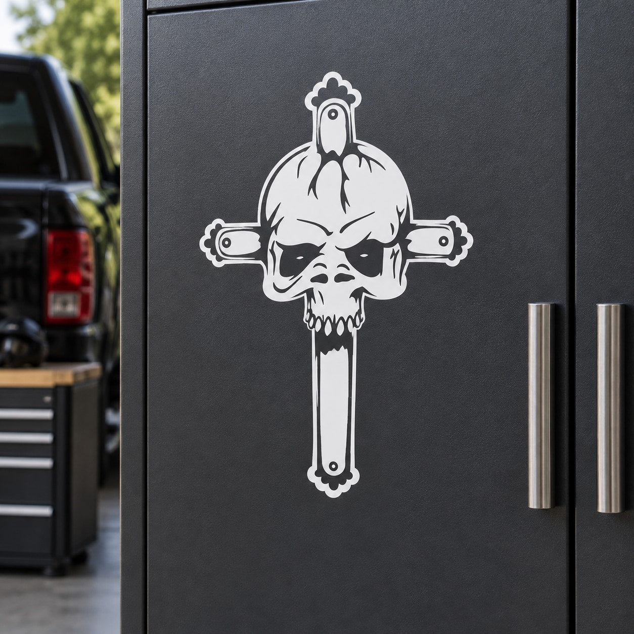 Skull vinyl decal featuring crowned skull with crossed arms design