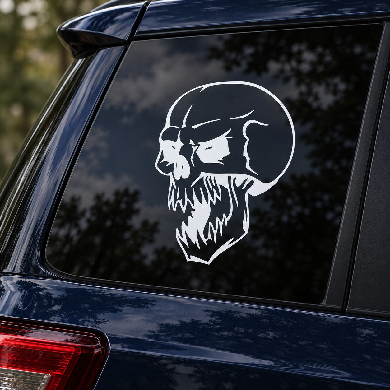 Skull vinyl decal sticker for car window, white graphic of a snarling skull face