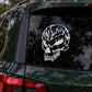 White skull vinyl decal on a car window