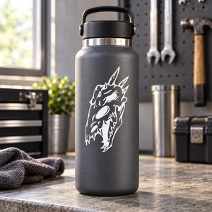 Skull face vinyl decal with sharp horned design in white on dark surface