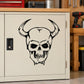 Black skull face vinyl wall decal with hollow eyes and jagged teeth