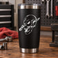 Black tumbler with white skull vinyl decal and silver metal rim