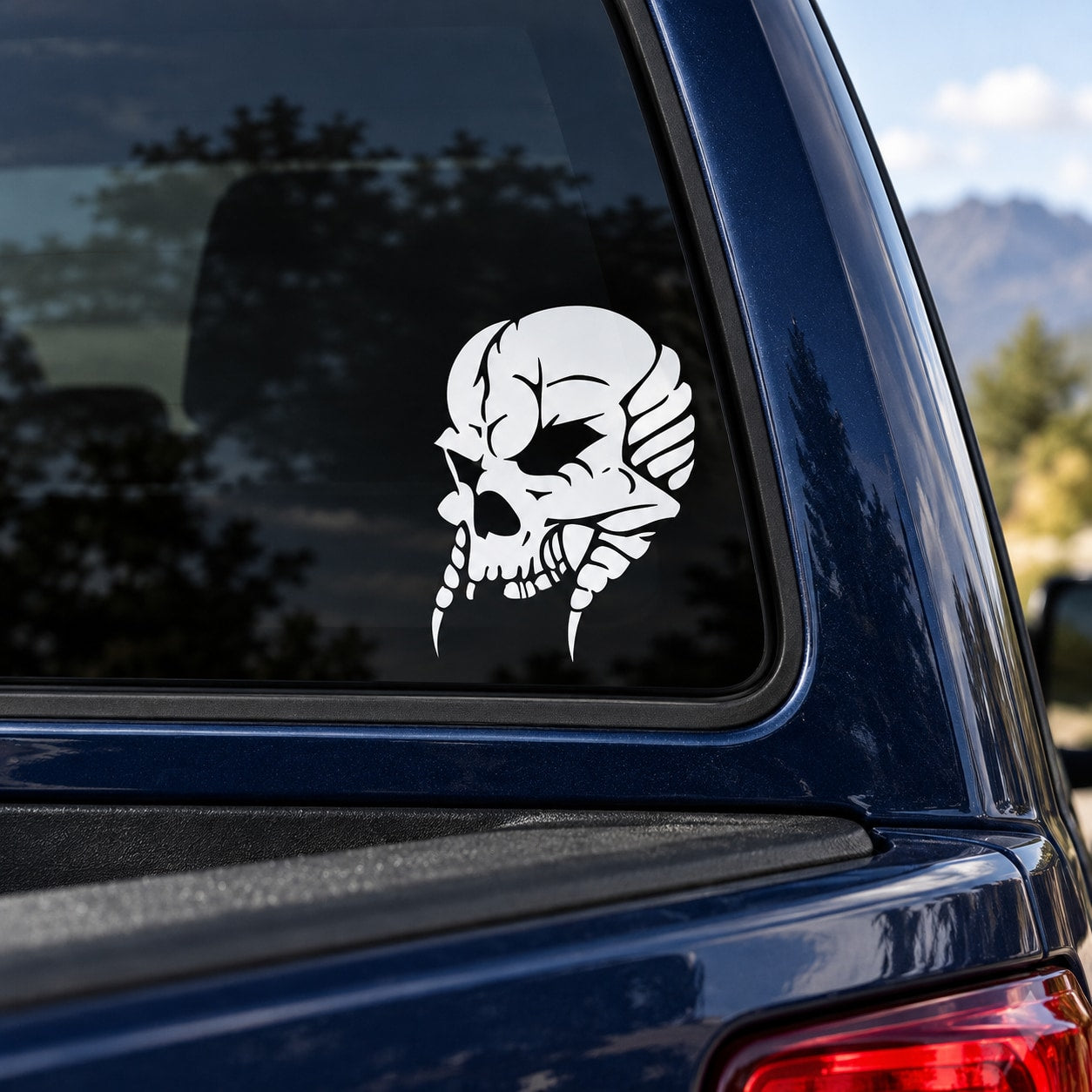 White skull wall decal with raised hand graphic on car window
