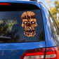 Split-head skull decal sticker, tan and brown with red eyes on a car window