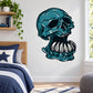 Teal underbite skull wall decal with dark outline and flame-style accents