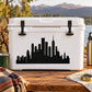 Black city skyline decal on a white cooler lid with two black latches