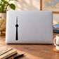 Black CN Tower silhouette decal on white laptop lid
