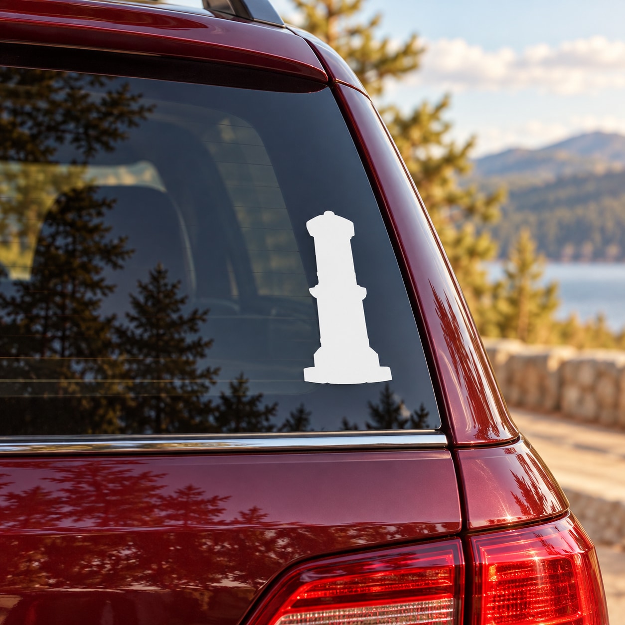 White pillar-shaped building decal on car rear window