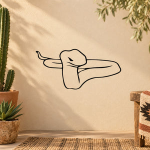 Staring snake wall decal with black outline line-art on beige surface