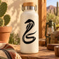 Black king cobra snake decal on white bottle, bold curved hood design