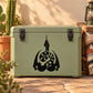 Black double-edged snake decal on green outdoor storage box