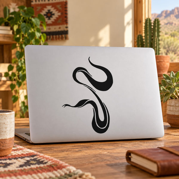 Black snake outline decal sticker on white laptop lid