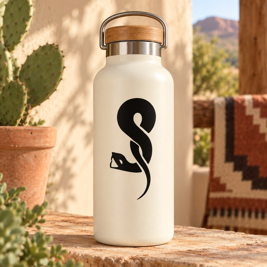 White bottle with black loop-twist snake decal on the front