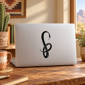 Black wispy snake decal on laptop lid