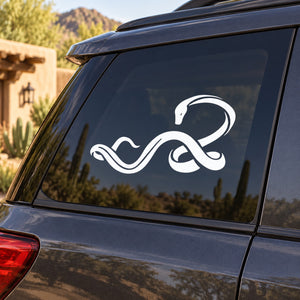 White twisting snake decal with curled tail on car window