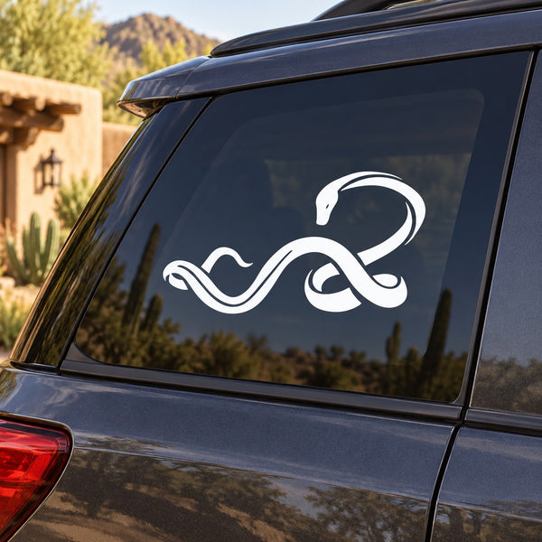 White twisting snake decal with curled tail on car window