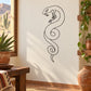 Coiled snake wall decal with open jaw in black line art