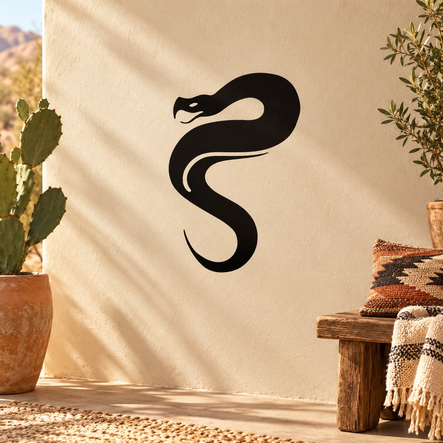 Black snake decal with bold facing design on tan surface