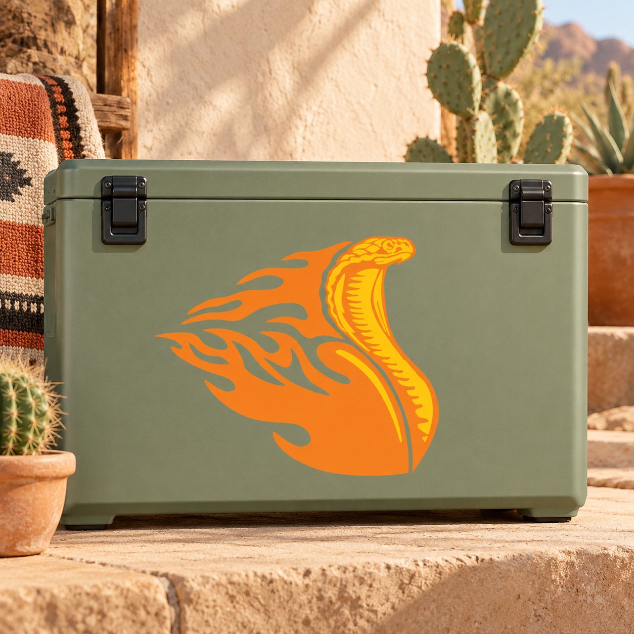 Orange cobra decal sticker with stylized fiery snake graphic on green surface