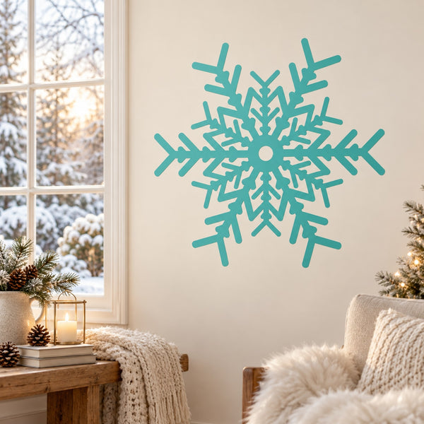 Teal snowflake window decal with intricate cutout pattern