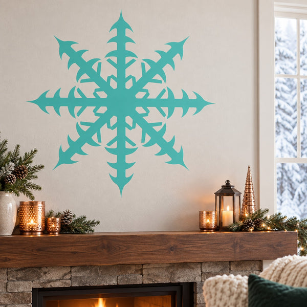 Radiating snowflake wall decal in teal with detailed symmetrical starburst design