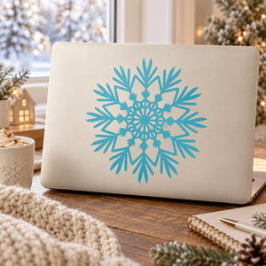 Turquoise snowflake decal on light surface