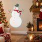 Snowman holiday sticker with green top hat, red scarf, and blue arms
