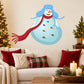 Snowman sticker with blue trapper hat and long red scarf, smiling round face