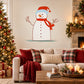 Cartoon snowman sticker with red hat, orange scarf, and ice-like base
