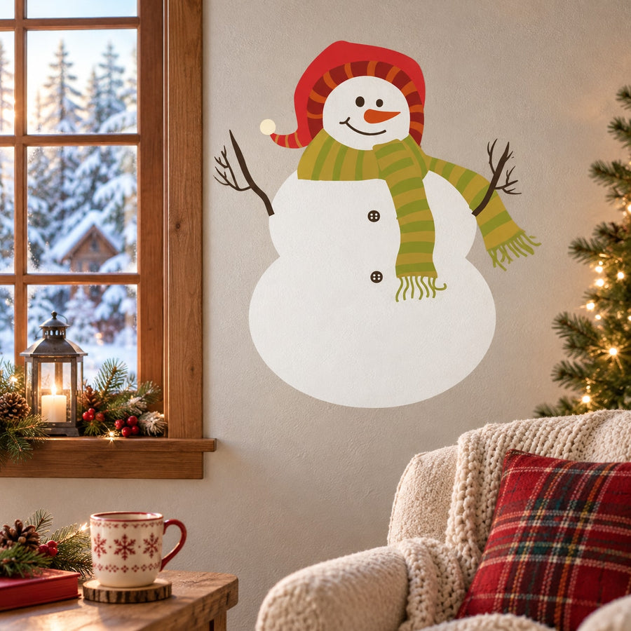 Snowman wall sticker with smiling face, red hat, green striped scarf, and carrot nose