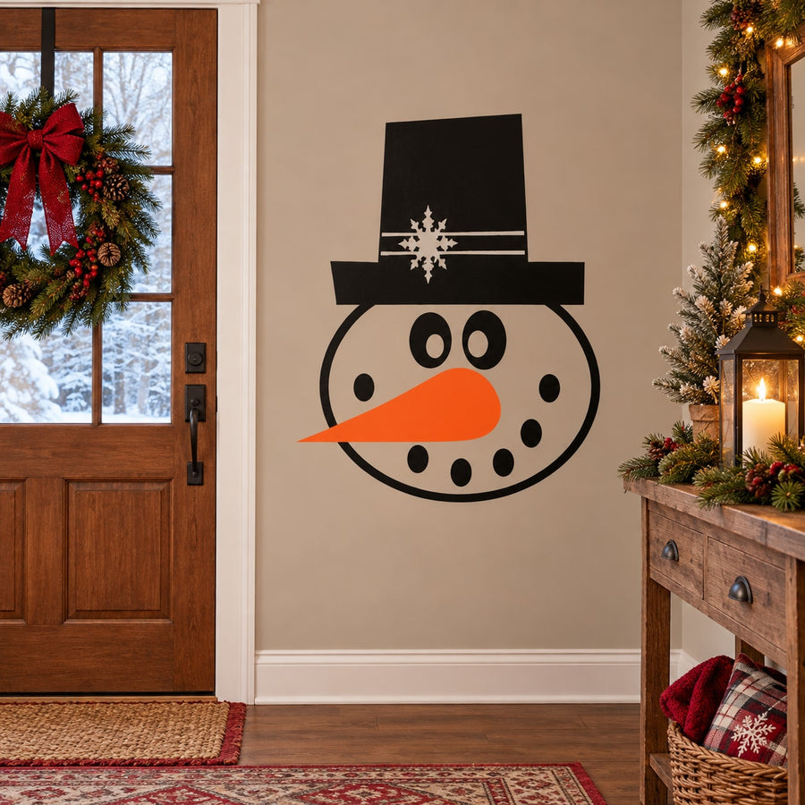 Die cut snowman face decal with black hat, orange carrot nose, and round white body
