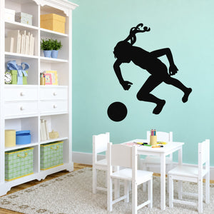 Soccer player wall vinyl decal, black silhouette kicking a ball