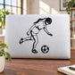 Soccer wall decal of a running player kicking a soccer ball, black vinyl silhouette
