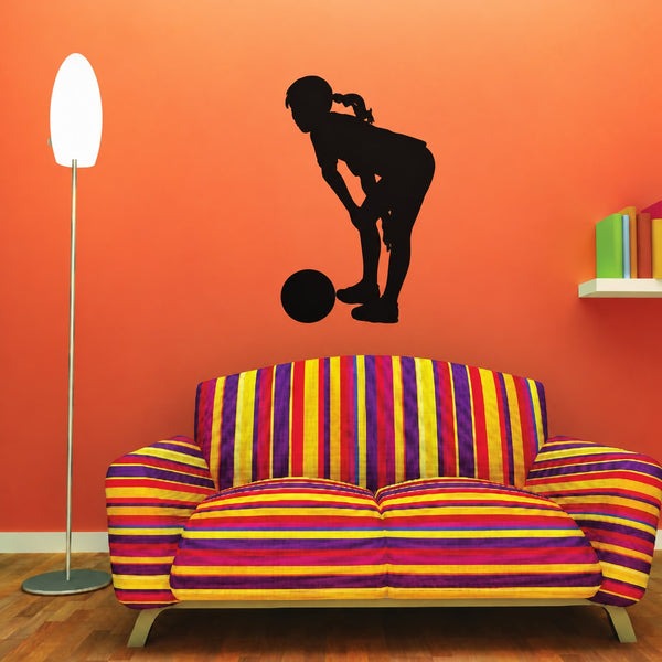 Vinyl soccer wall decal of a player silhouette kicking a ball