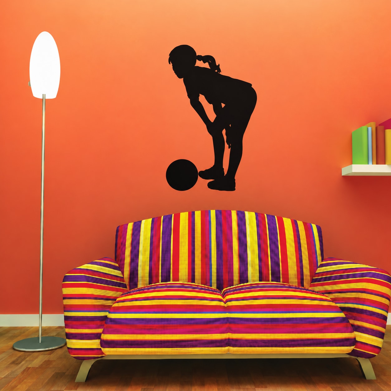 Vinyl soccer wall decal of a player silhouette kicking a ball