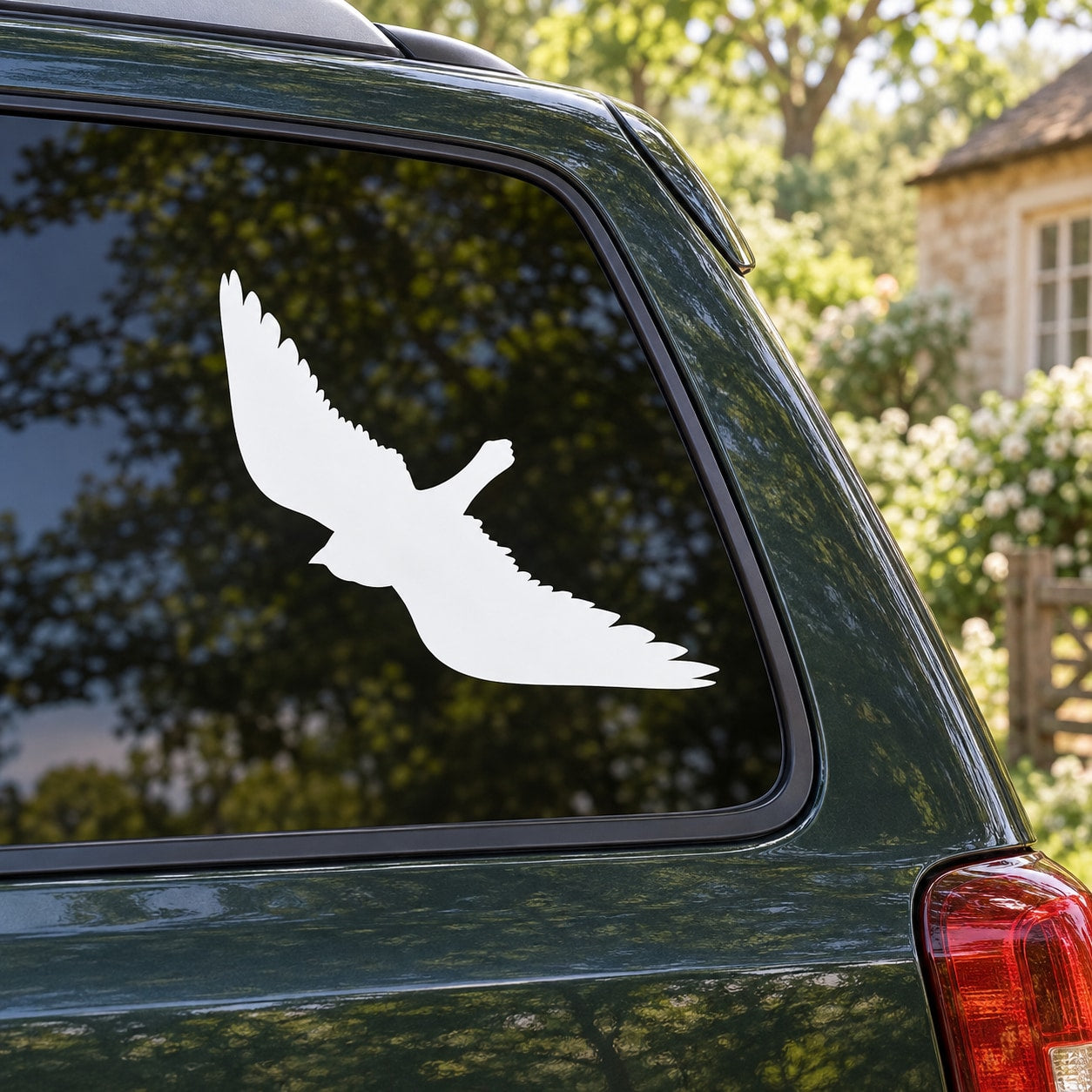 White bird hovering decal on car window