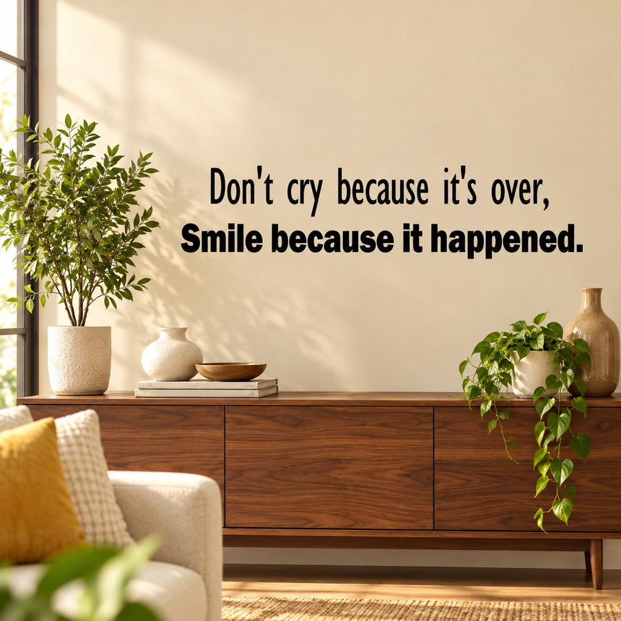 Wall decal with black quote text: "Don't cry because it's over, smile because it happened"