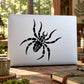 Black wobbly spider decal on a light rectangular surface