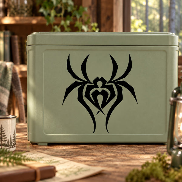 Black open spider decal with stylized spider web graphic on light green surface