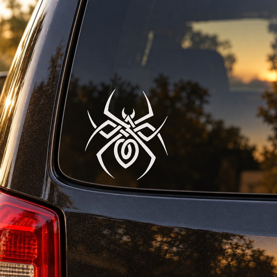 White spider web decal with spider emblem on dark car surface