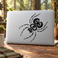 Black ornate spider decal with curved swirl body and beaded-style line details