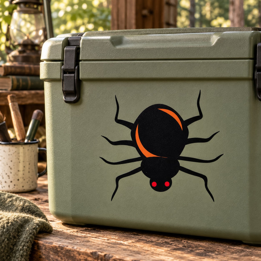 Rounded spider sticker with black body, orange ring, red dots and eight legs