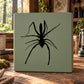 Black spider wall decal on light green rectangular board