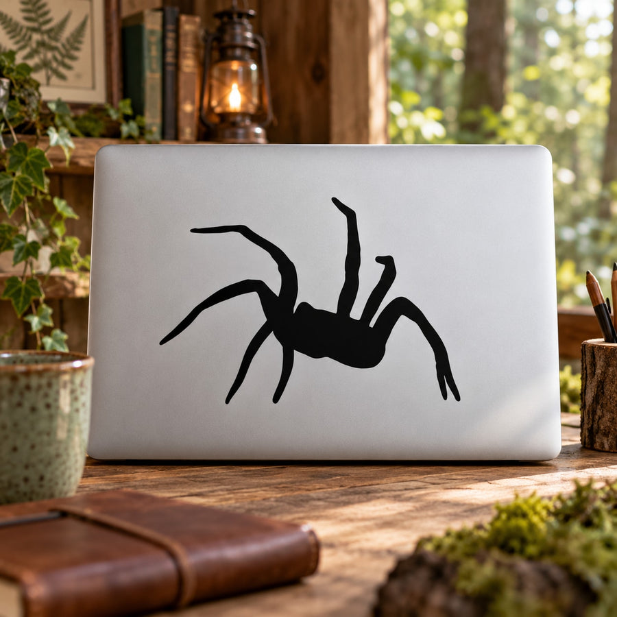 Attacking spider decal, black spider silhouette on white surface