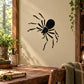 Black spider wall decal with web-like legs on light beige surface