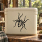 Black spider decal sticker on light-colored surface